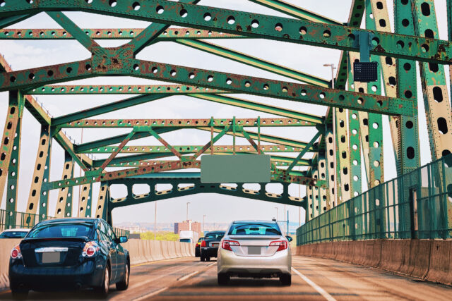 car driving across a bridge