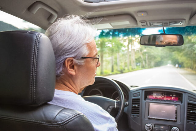 senior man driving