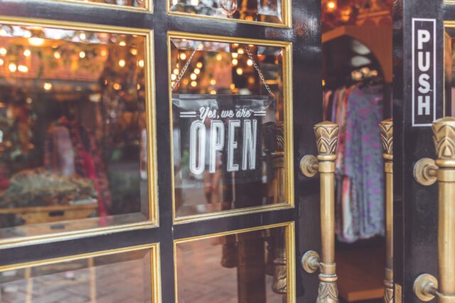 A storefront door in New Jersey proudly displays a sign that reads 