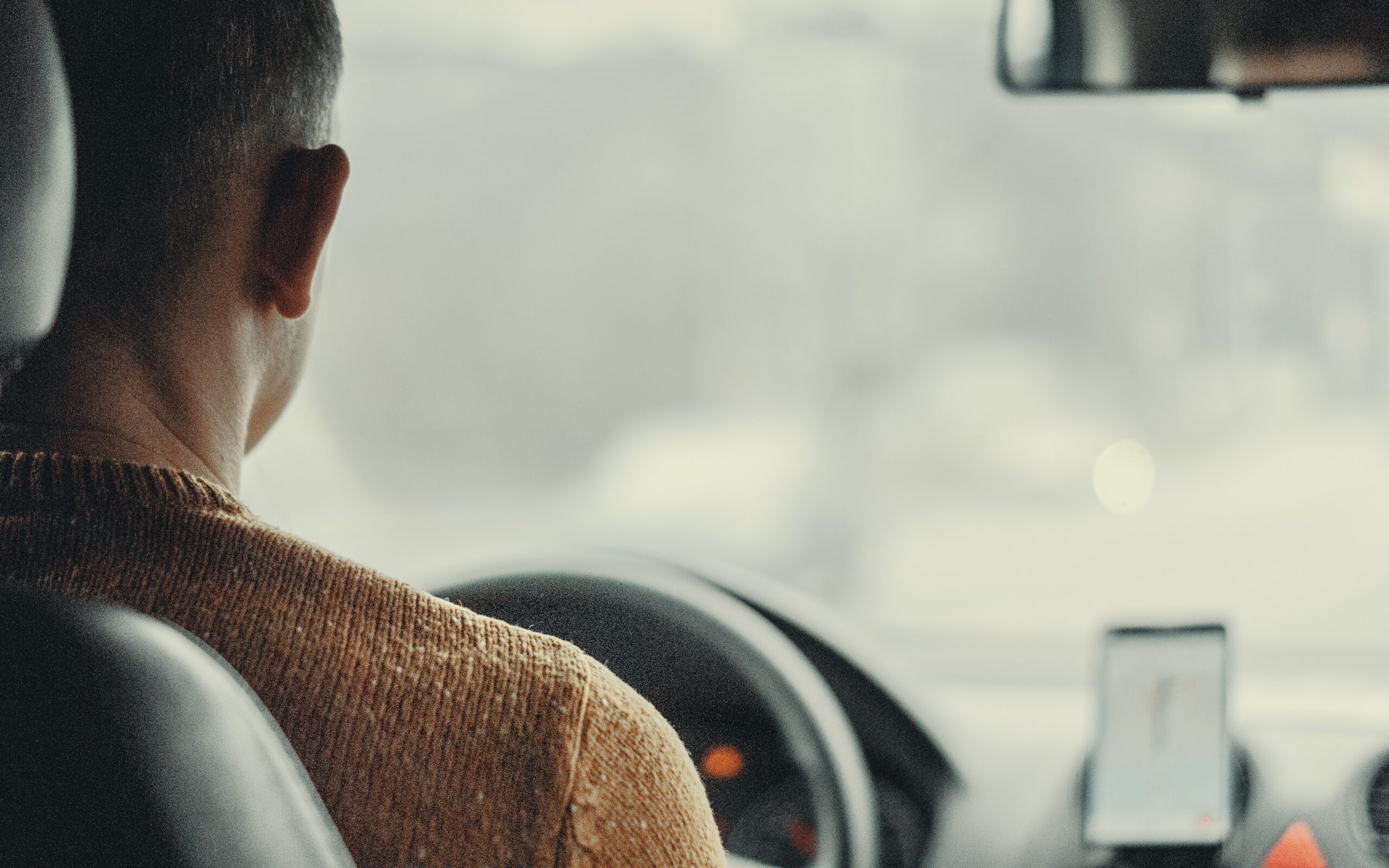 driver behind the wheel of a car