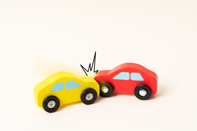 Two mini toy car crash with ambulance and police car. Toy car